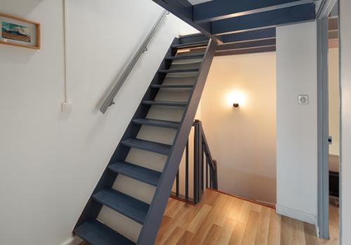 Stairs to the top floor twin bedroom